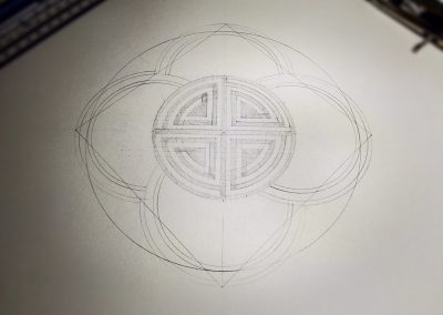Pencil outline shows the squaring of the circle underpinning the design